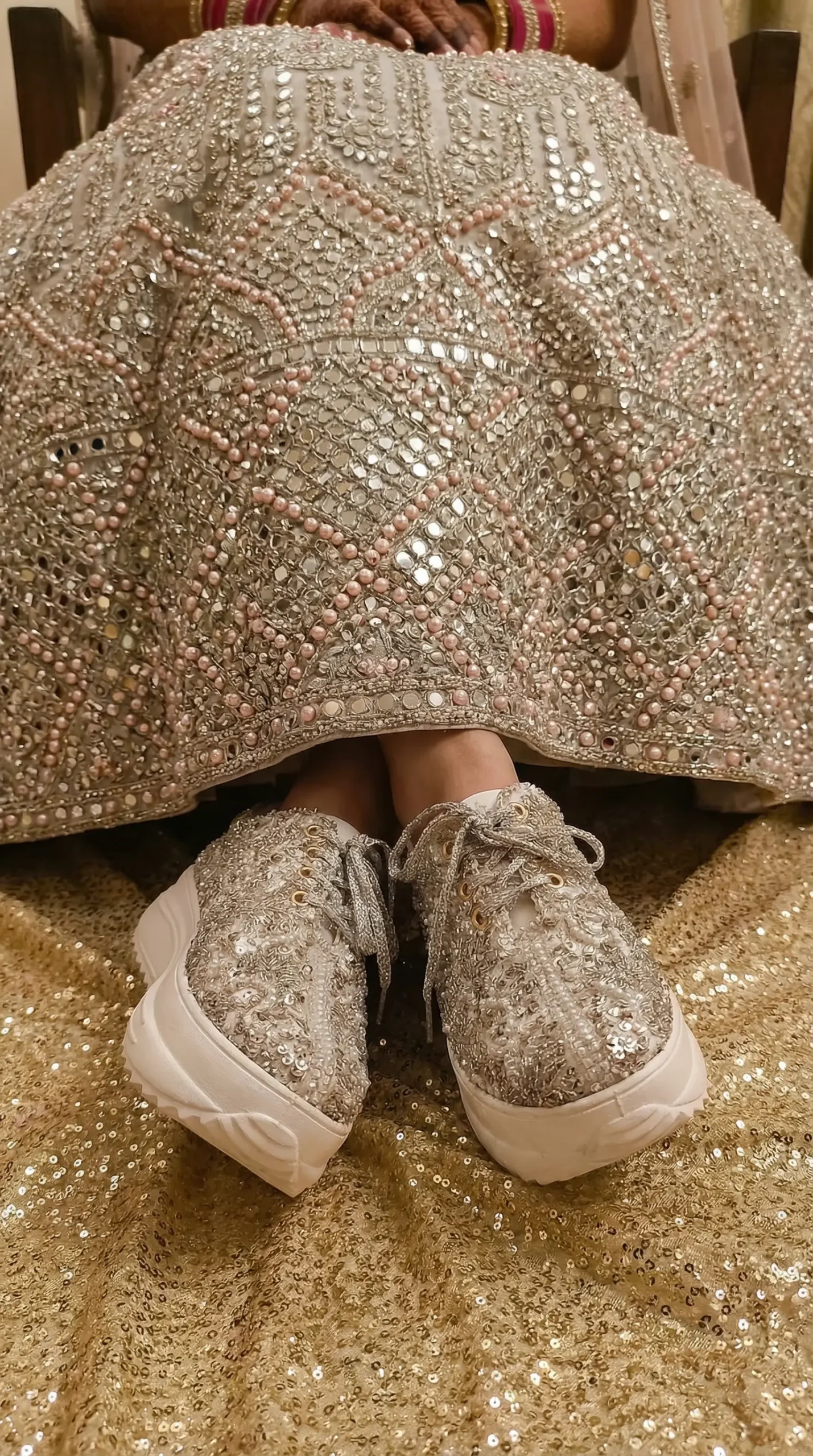 Firefly_Gemini Flash_Create an image in which a bride wearing Silver with pink pearl all over the lehenga 177748