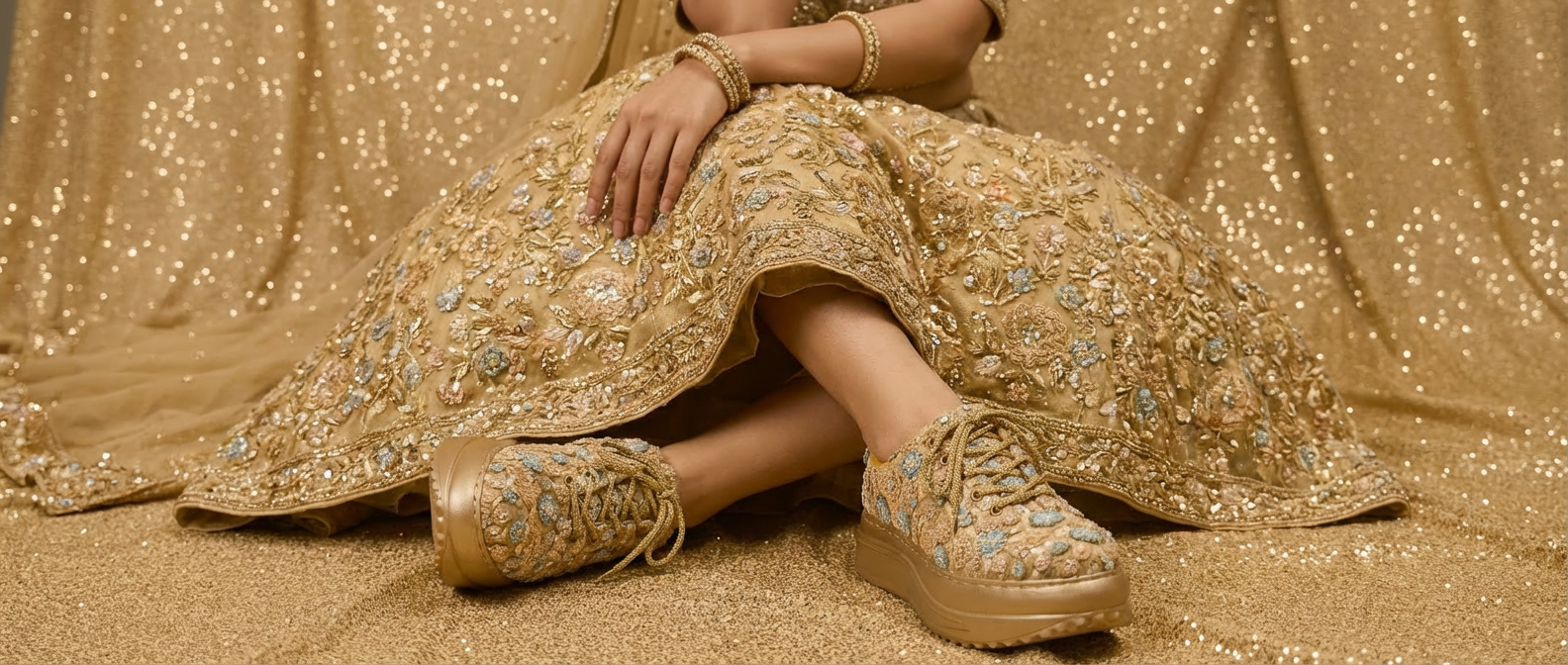 Firefly_Gemini Flash_i need a photo of this sneakers with a model wearing gold floral lehenga wearing the 63962