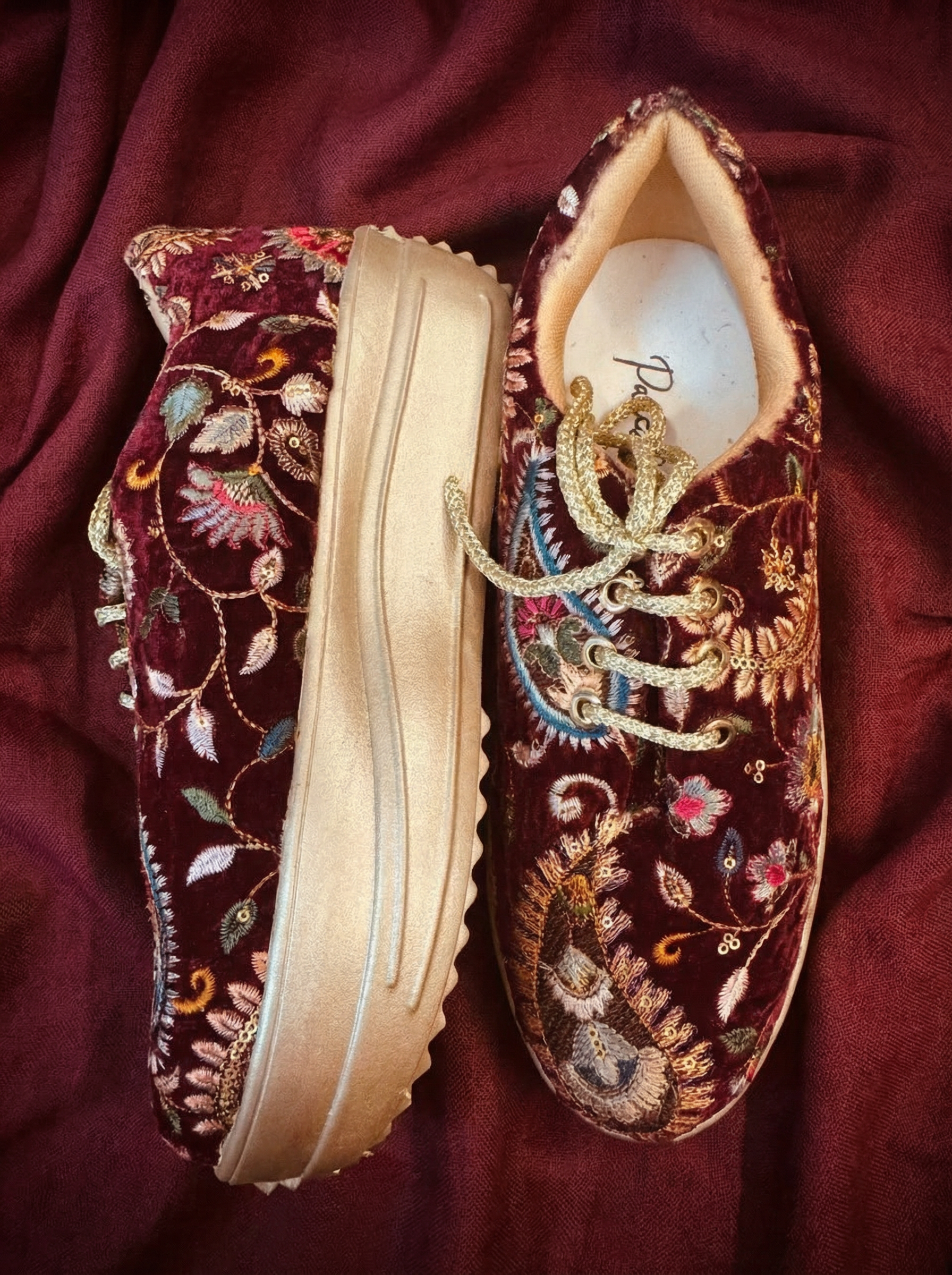 Firefly_Gemini Flash_Create an image for my website of the sneakers in the reference image with maharoon c 228180