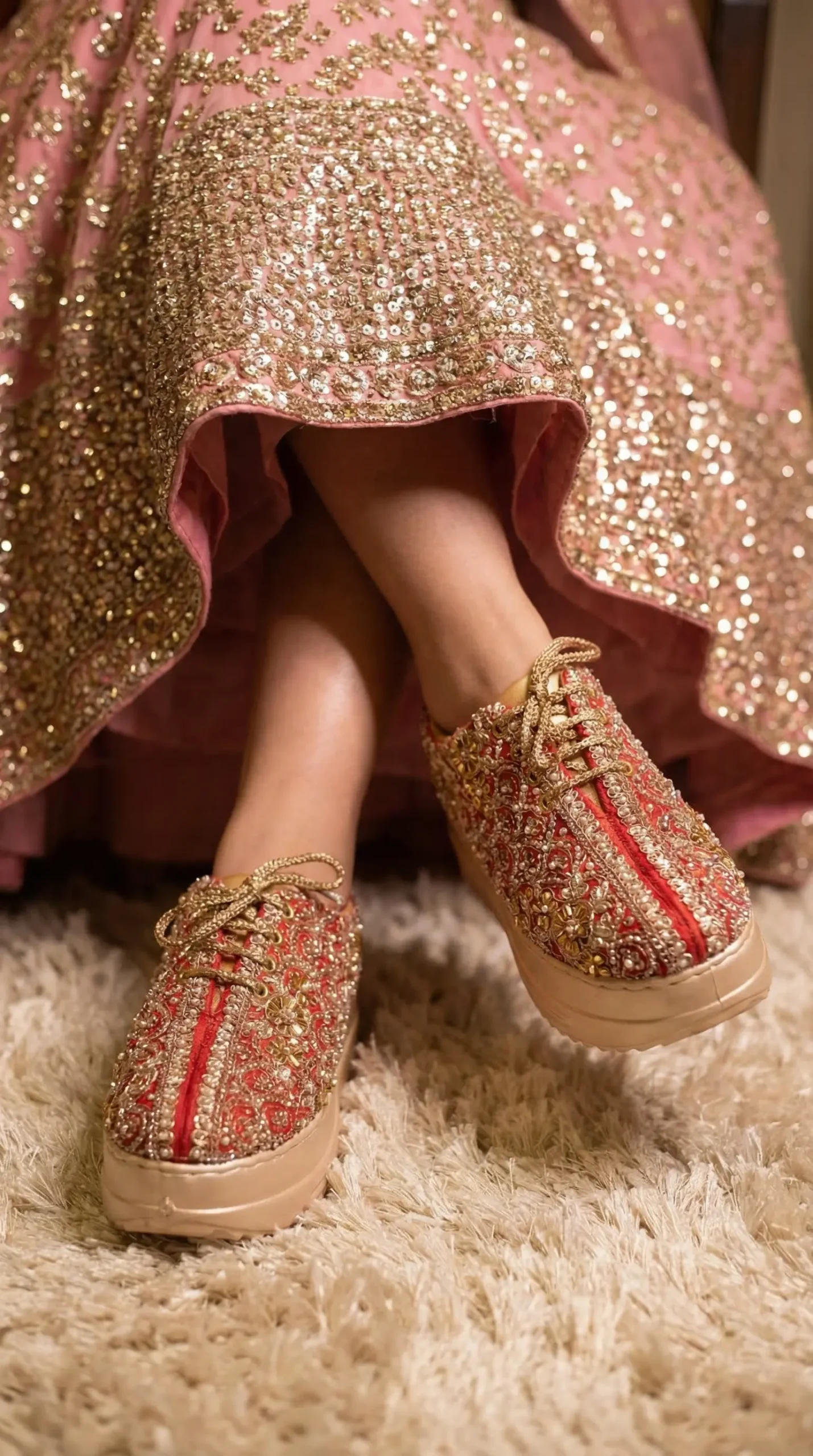 Firefly_Gemini Flash_Create an image in which the bride is wearing pink lehenga with full sequnce work on 403478