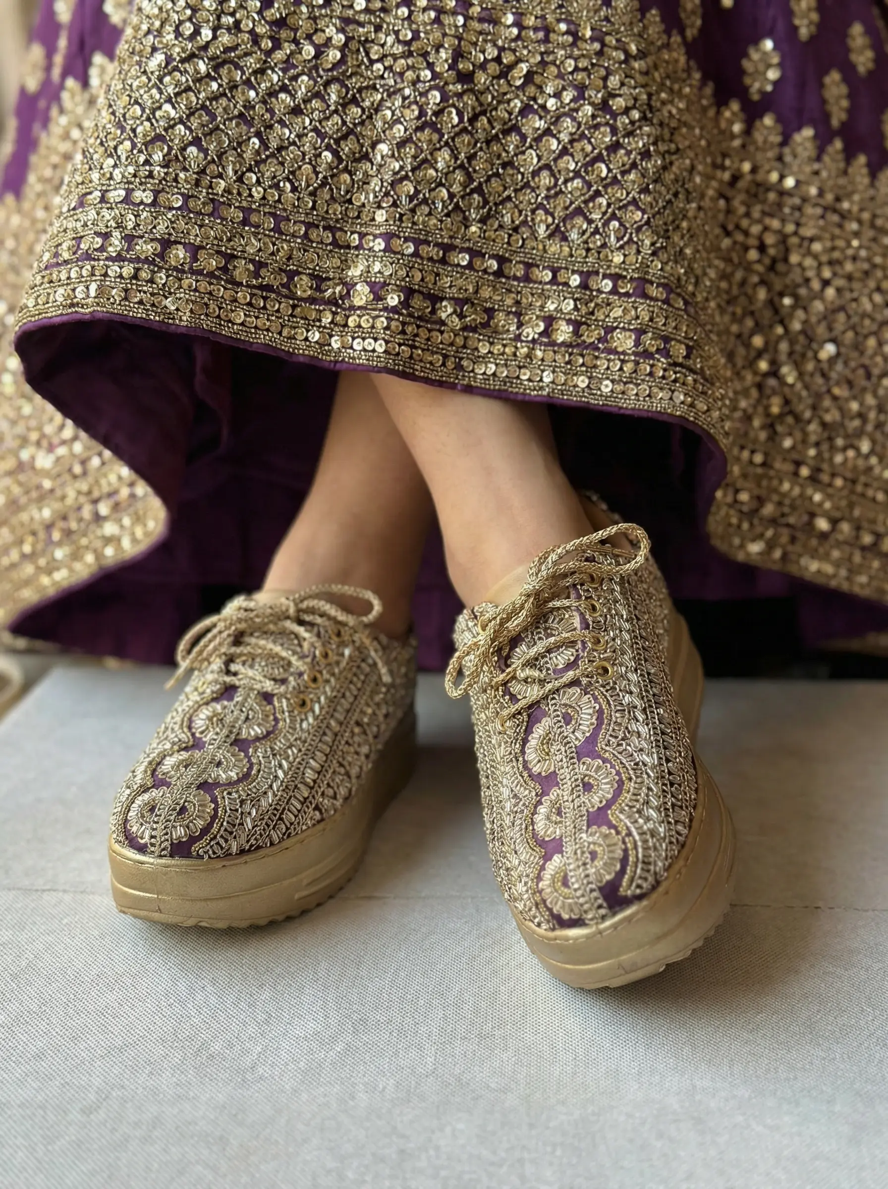 Firefly_Gemini Flash_Create an image in which the bride is wearing purple lehenga with full sequnce work o 289959